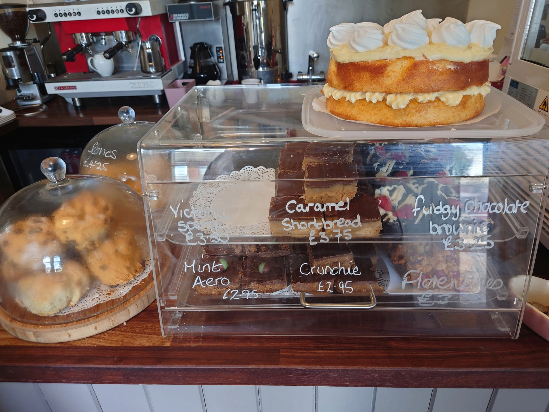 Cake counter with scones and traybakes at Gatehouse Cafe